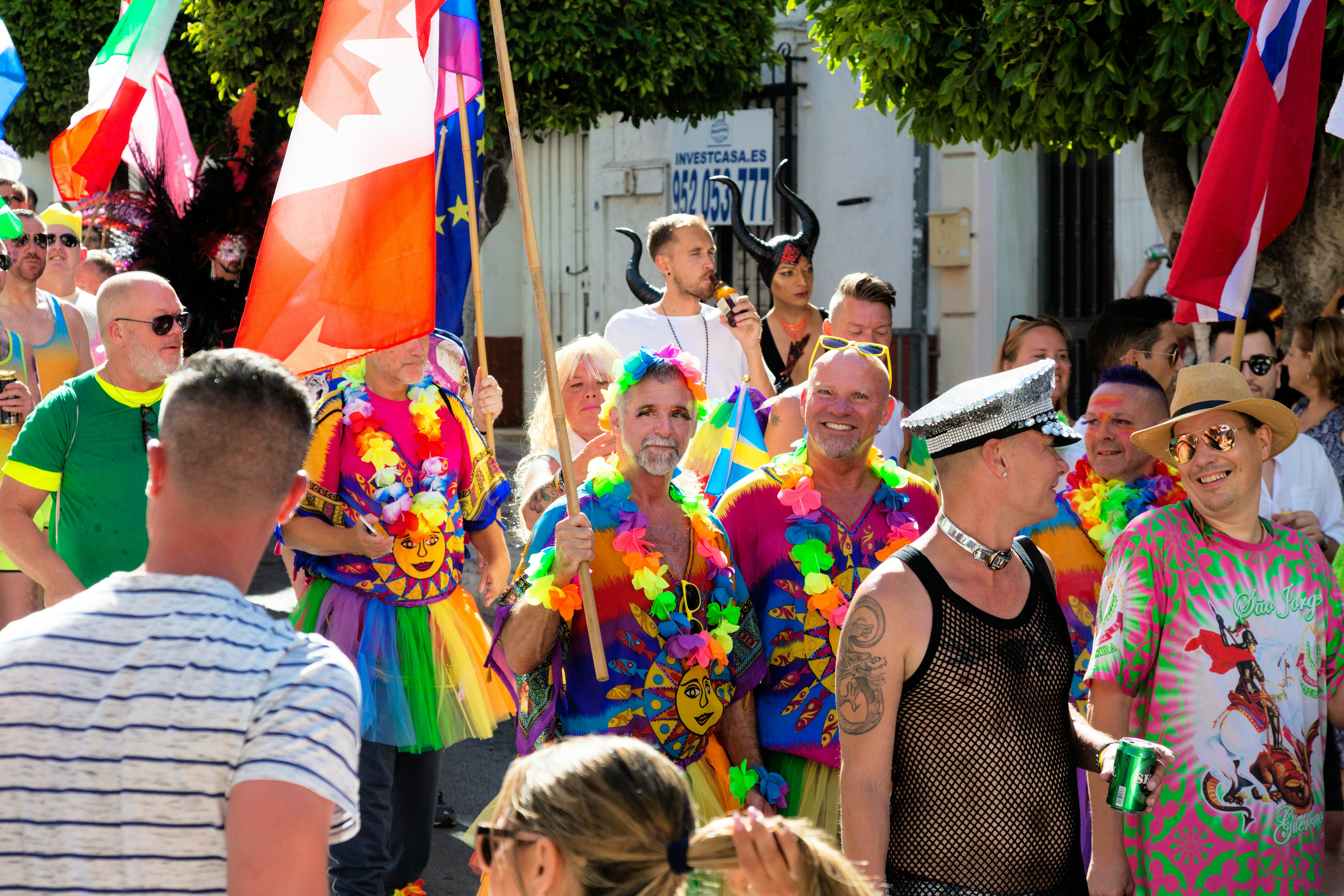 group of people standing on street during daytime